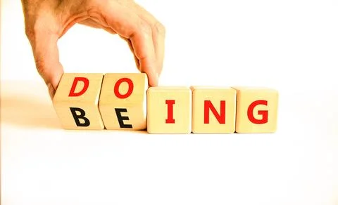 Doing or being symbol. Concept word Doing and Being on wooden cubes. Busine.. Stock Photos