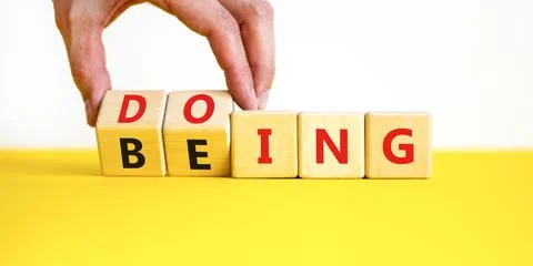 Doing or being symbol. Concept word Doing and Being on wooden cubes. Busine.. Stock Photos