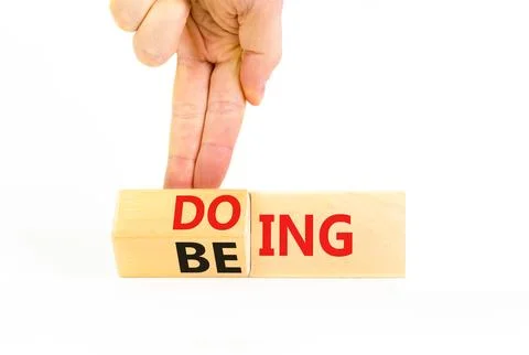 Doing or being symbol. Concept word Doing and Being on wooden cubes. Busine.. Stock Photos