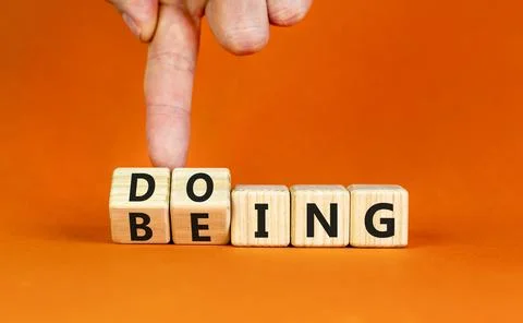 Doing or being symbol. Concept word Doing and Being on wooden cubes. Busine.. Stock Photos