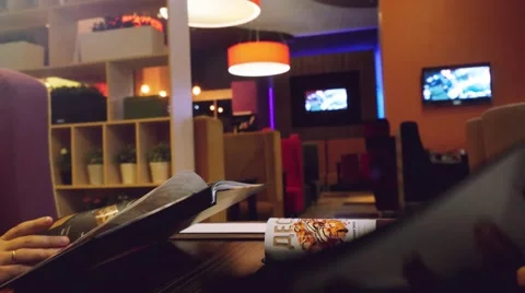 Doing order in a coffee shop and holding the menu Stock-Footage 58117937