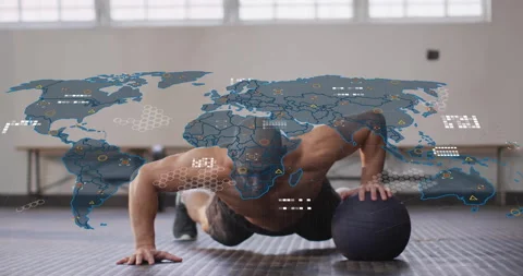 Doing push-ups on medicine ball, man with animation of world map data overlay 動画素材 305493925