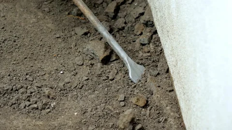 Doing the repair work. Drilling the concrete with help of a jackhammer Stock Footage 147218329
