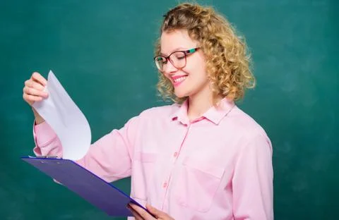 Doing research. teacher with document folder. happy student in glasses at Stock Photos
