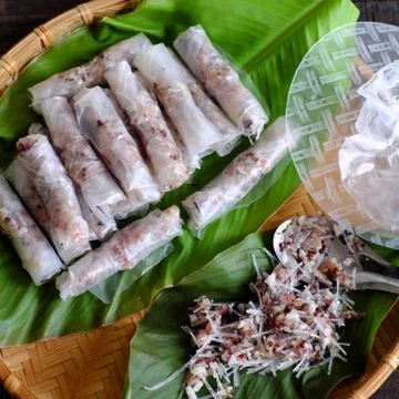 Doing spring rolls Stock Photos