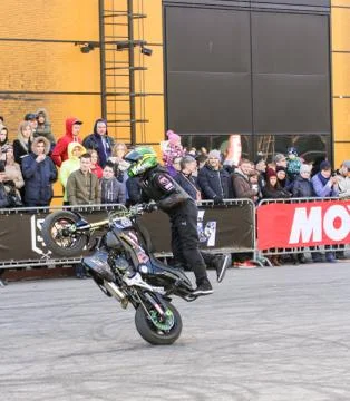 Doing tricks on a bike. Stock Photos
