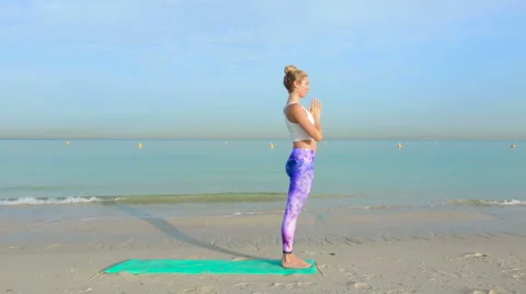 Doing various yoga poses Stock Footage 64025190