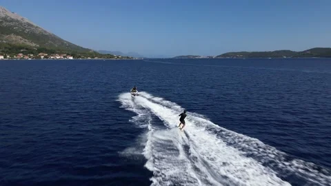 Doing Wakeboard Behind Jetski During Summer Stock-Footage 216923032