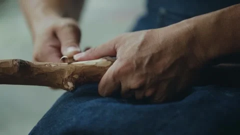 Doing woodworking with a carving knife Stock Footage 266865251