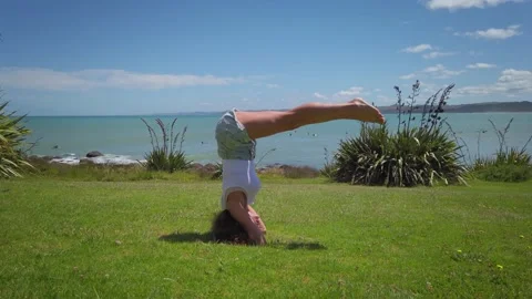 Doing Yoga by the beach Stock-Footage 145836810