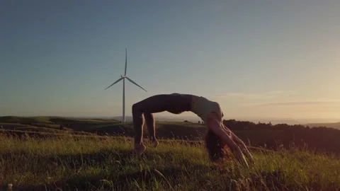 Doing Yoga high up on a hill Stock-Footage 145836918