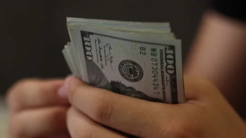 Dolar 3Hands counting US Dollar bills or paying in cash on money background. Stock Footage 137124736