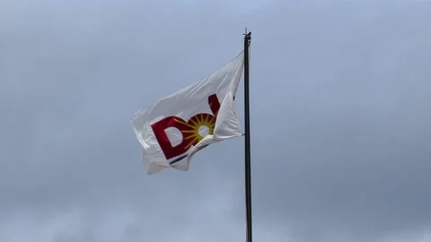 Dole logo flag on top of the main building at Dole Plantation in Oahu, Stock Footage 142112086