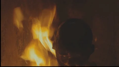 The doll burns with a bright flame. an eerie spectacle of burning Stock Footage 212546111