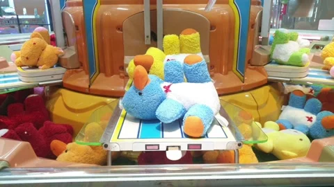 Doll Catcher Machine Electronic Simulate Claw Machine with Lights Sounds Stock Footage 143640264