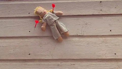 Doll with darts slomo Video stock 114636688