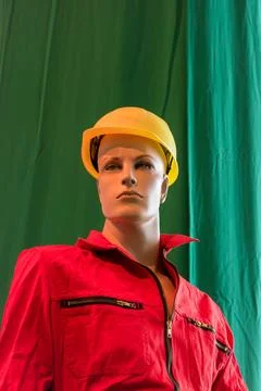 A doll dressed as a construction worker with helmet and overall Stock Photos