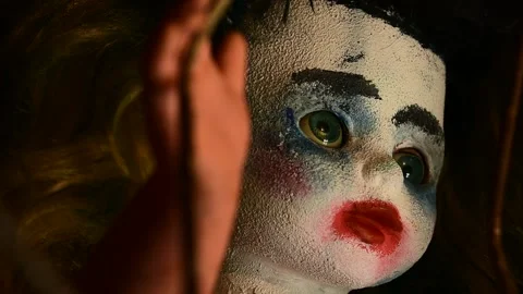 Doll looks at light, face Stock Footage 135386752