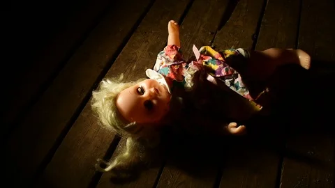 Doll lying on the floor Stock Footage 120246930