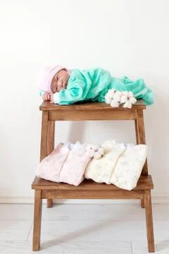 Doll in newborn clothes Stock Photos