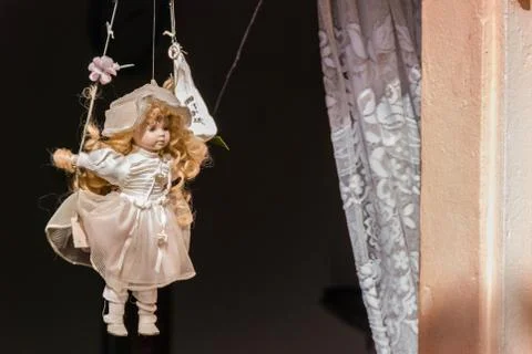 Doll puppet in the window Stock Photos