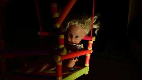 Doll in the uneven light of a lantern Stock Footage 120246782