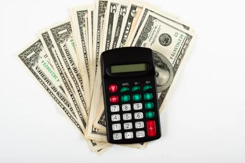 Dollar and calculator Stock Photos