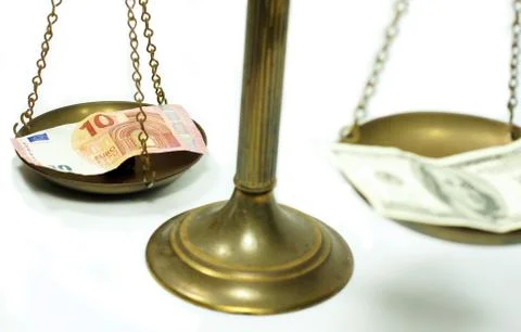 Dollar and Euro notes on scale Stock Photos