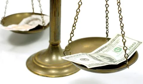 Dollar and Pound notes on scale Stock Photos