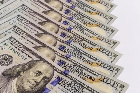 Dollar banknotes background. Close up view of pile of US dollars. Stock Photos