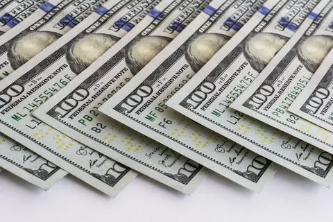 Dollar banknotes background. Close up view of pile of US dollars. Stock Photos
