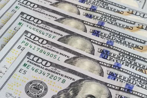 Dollar banknotes background. Close up view of pile of US dollars. Stock Photos