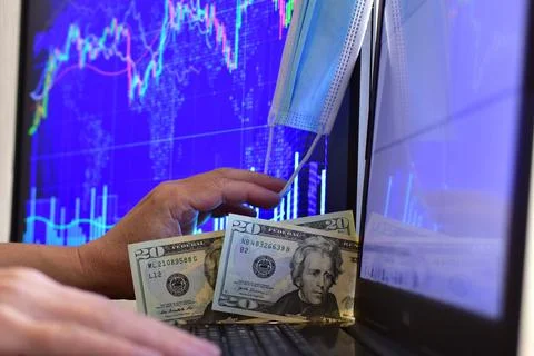 Dollar banknotes on blurred background of computer screen Stock Photos