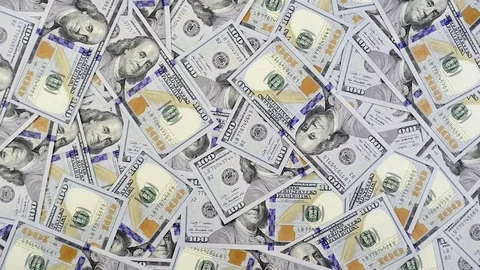 Dollar banknotes falling on table covered with cash Video stock 70217699