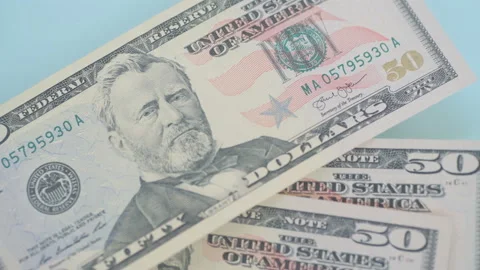 Dollar banknotes flying over the stopwatch dial. Financial money concept . Видео 156301089