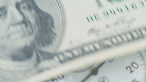 Dollar banknotes flying over the stopwatch dial. Financial money concept Stock-Footage 156301130