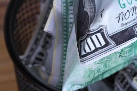 Dollar Banknotes inside Rubbish Bin Stock Photos