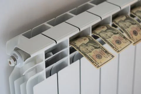 Dollar banknotes put on warm room heating battery to dry from accidentally Stock Photos