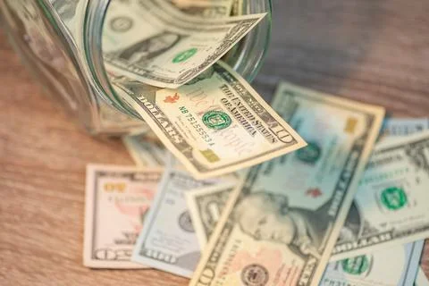Dollar banknotes on the wooden table Stock Photos
