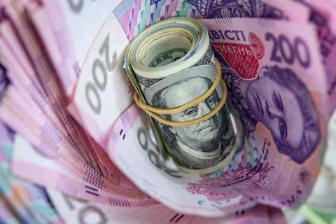 Dollar Bill On Background Of Different Ukrainian Hryvnia Banknotes Stock Photos