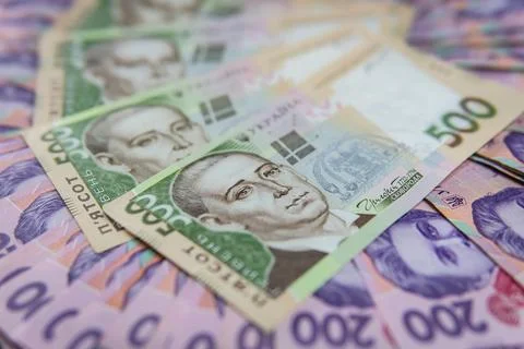 Dollar Bill On Background Of Different Ukrainian Hryvnia Banknotes Stock Photos