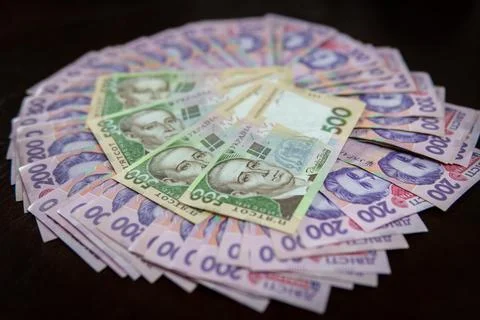 Dollar Bill On Background Of Different Ukrainian Hryvnia Banknotes Stock Photos