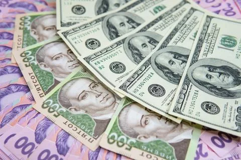 Dollar Bill On Background Of Different Ukrainian Hryvnia Banknotes Stock Photos