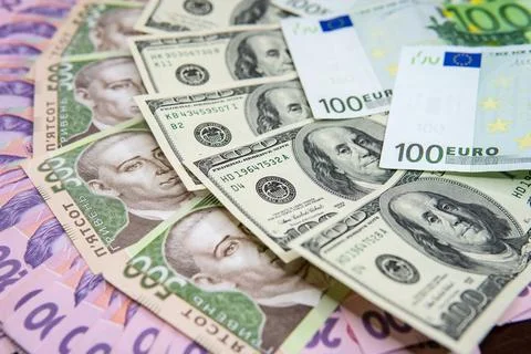 Dollar Bill On Background Of Different Ukrainian Hryvnia Banknotes Stock Photos