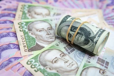 Dollar Bill On Background Of Different Ukrainian Hryvnia Banknotes Stock Photos