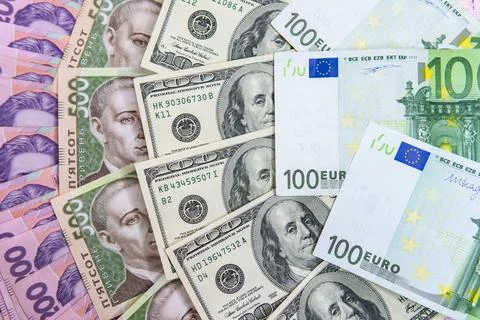 Dollar Bill On Background Of Different Ukrainian Hryvnia Banknotes Stock Photos