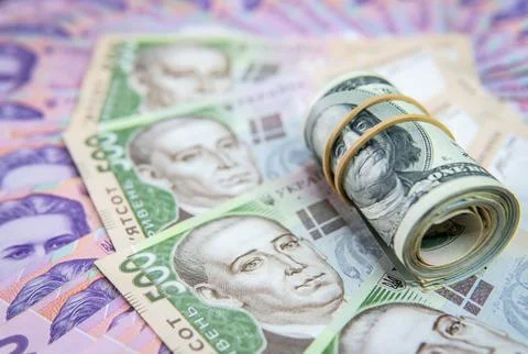Dollar Bill On Background Of Different Ukrainian Hryvnia Banknotes Stock Photos