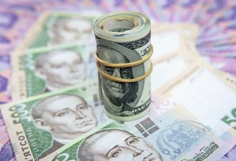 Dollar Bill On Background Of Different Ukrainian Hryvnia Banknotes Stock Photos