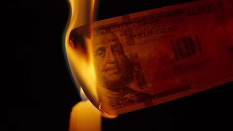 Dollar bill burning in close-up flame Stock Footage 345022440