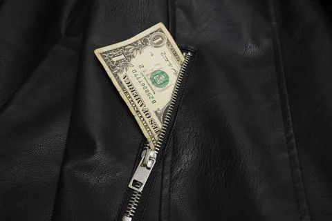 Dollar bill in leather jacket pocket Stock Photos